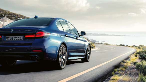 Integral Active steering BMW 5 Series Sedan G30 Integral Active steering BMW 5 Series Sedan G30 Facelift 2020 three-quarter rear view driving shot