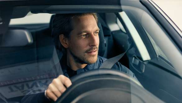 Man driving BMW BMW 5 Series Sedan G30 Man driving BMW looking through windshield BMW 5 Series Sedan G30