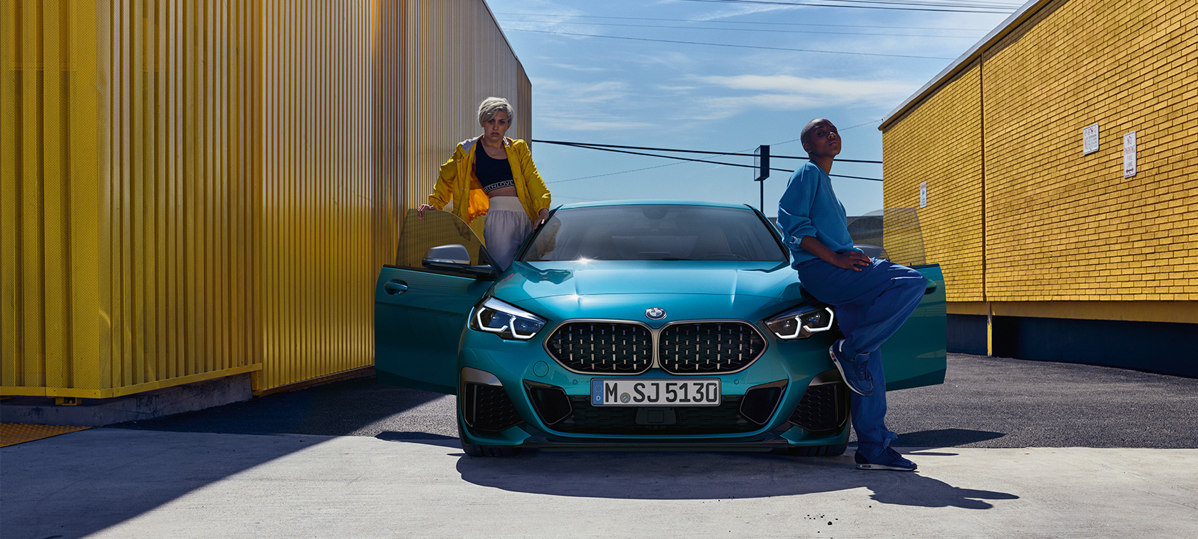 BMW 2 Series Gran Coupé front view with open front doors BMW 2 Series Gran Coupé Snapper Rocks Blue metallic F44 front view with open front doors