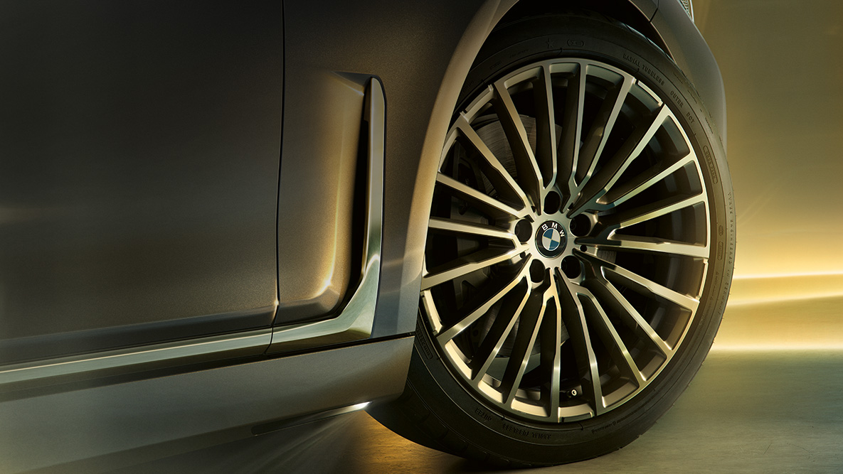 BMW 7 Series Sedan G11 G12 2019 Bernina Grey BMW 7 Series Sedan G11 G12 2019 Bernina Grey Amber Effect three-quarter rear view surrounded by beam of light