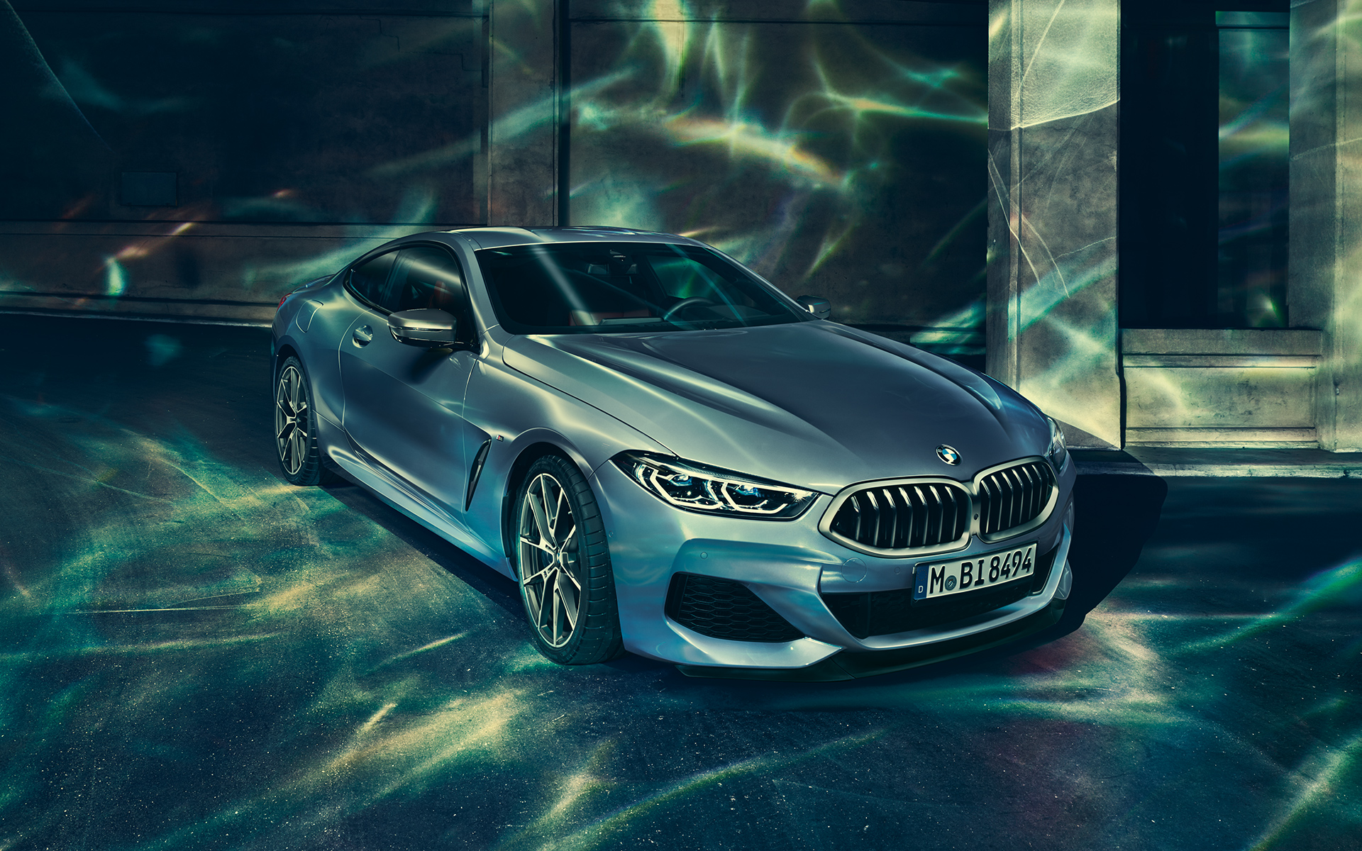 BMW 8 Series Coupé, three-quarter back-right A three-quarter back-right still shot of the BMW 8 Series Coupé in an urban setting.