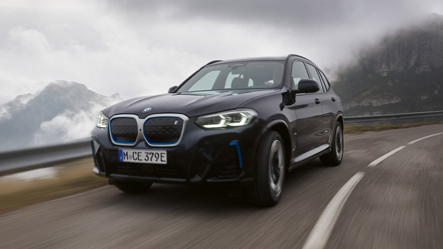 BMW X Series BMW iX3 G08 first generation three-quarter front view driving BMW X Series BMW iX3 G08 first generation three-quarter front view driving