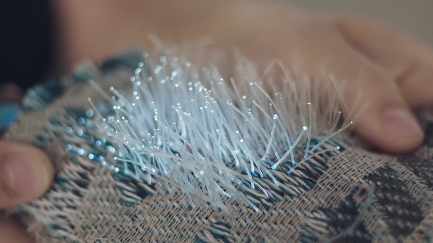 Patterned beige brown fabric with light fibres