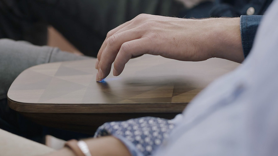 Hand in cockpit of the BMW Vision iNEXT in coffee table