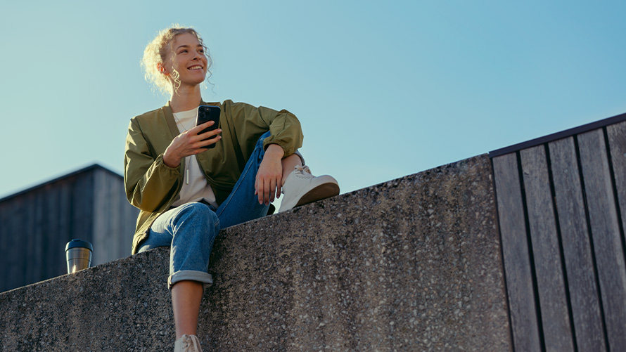 Remote Software Upgrade Drive Recorder woman with smartphone on wall