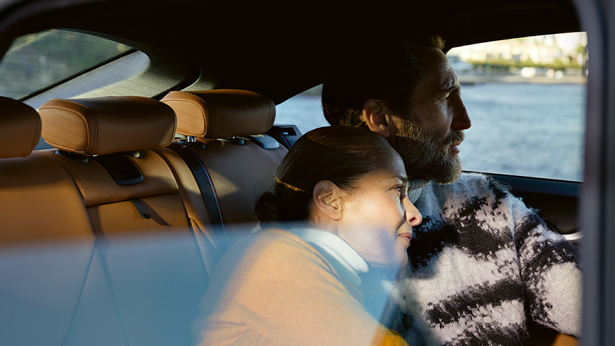 Woman and man sitting in BMW and looking out the window BMW Extended Warranty Woman and man sitting in BMW and looking out the window